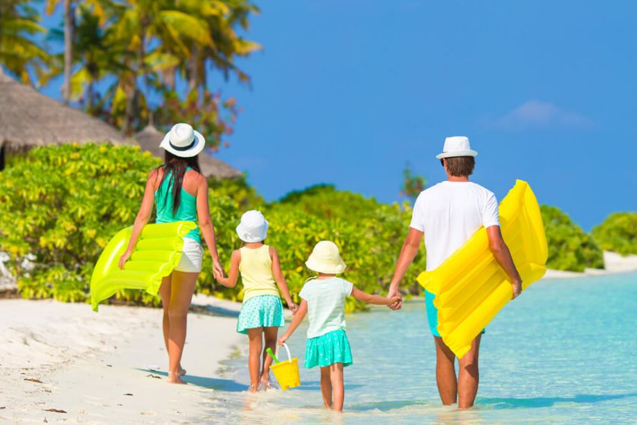 Family walking along a beach