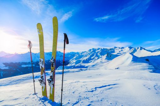 Skis & Poles placed into snow on a mountain